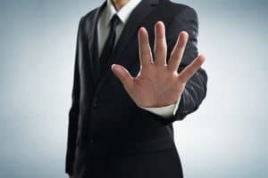 Person holding up their hand