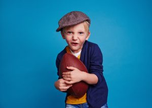Child holding football