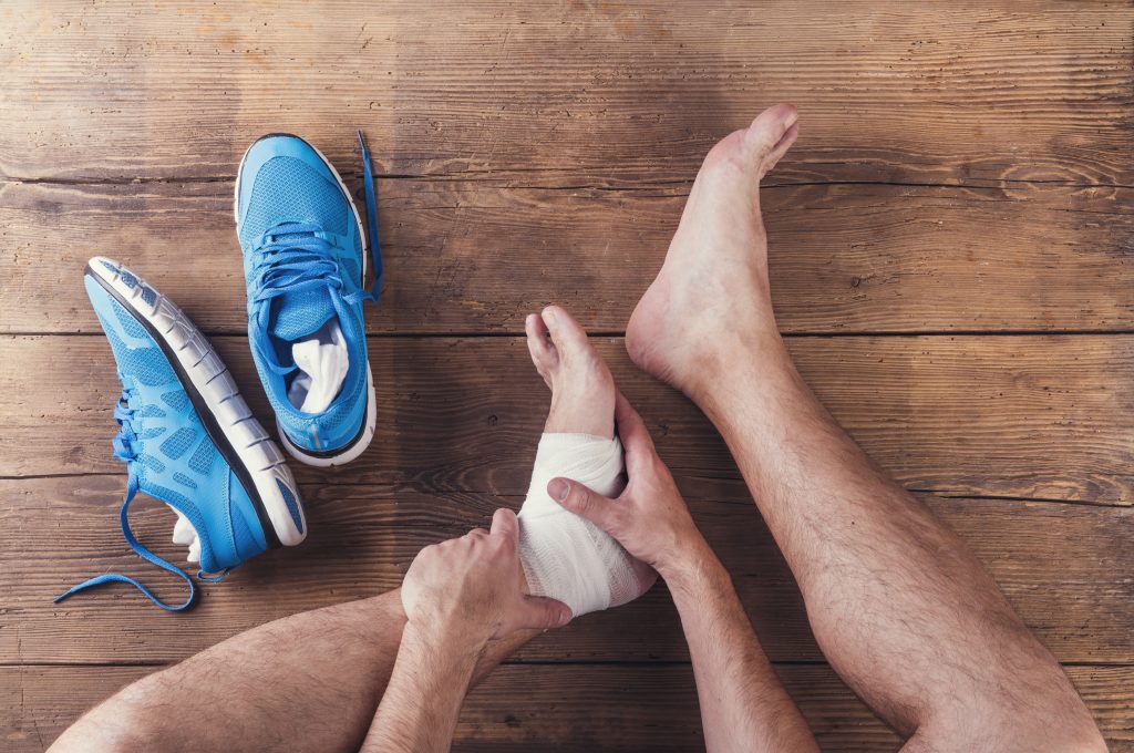 Person rubbing ankle