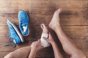 Person rubbing ankle
