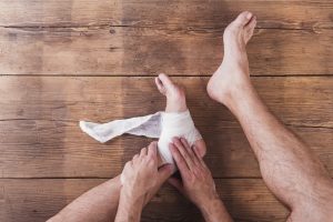 Person rubbing ankle