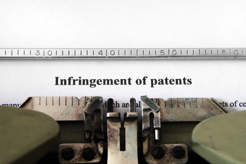 "Infringement of patents" typed on typewriter