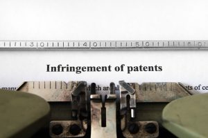 "Infringement of patents" typed on typewriter