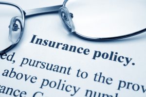 Glasses laying on an insurance form