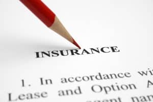 Insurance form with a red pencil