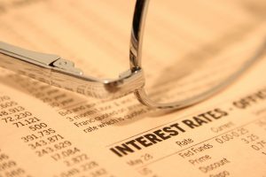 glasses laying on interest rates table