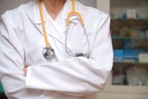 Doctor standing with arms crossed