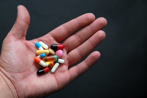 Hand holding pills