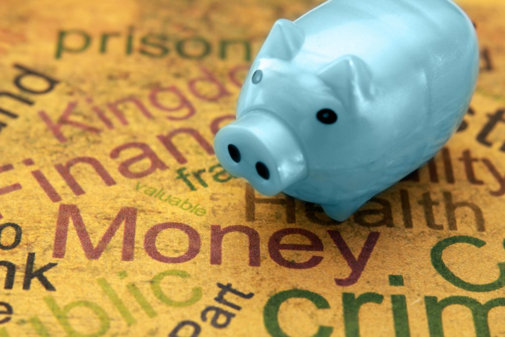 Piggy bank sitting on parchment