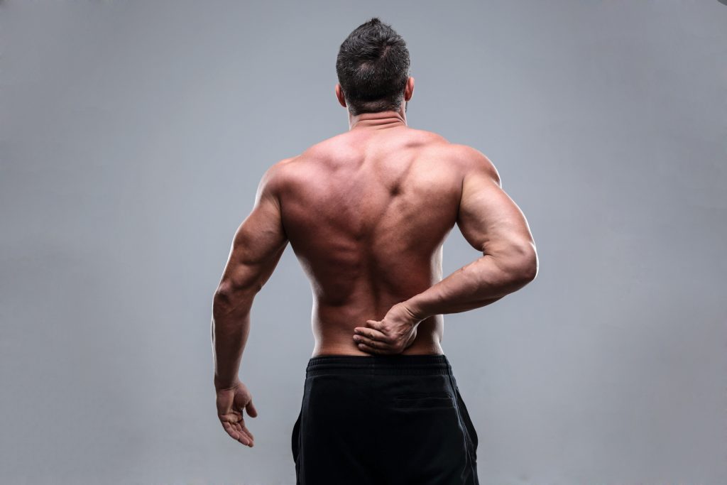 Person rubbing lower back