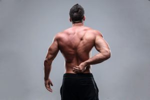 Person rubbing lower back