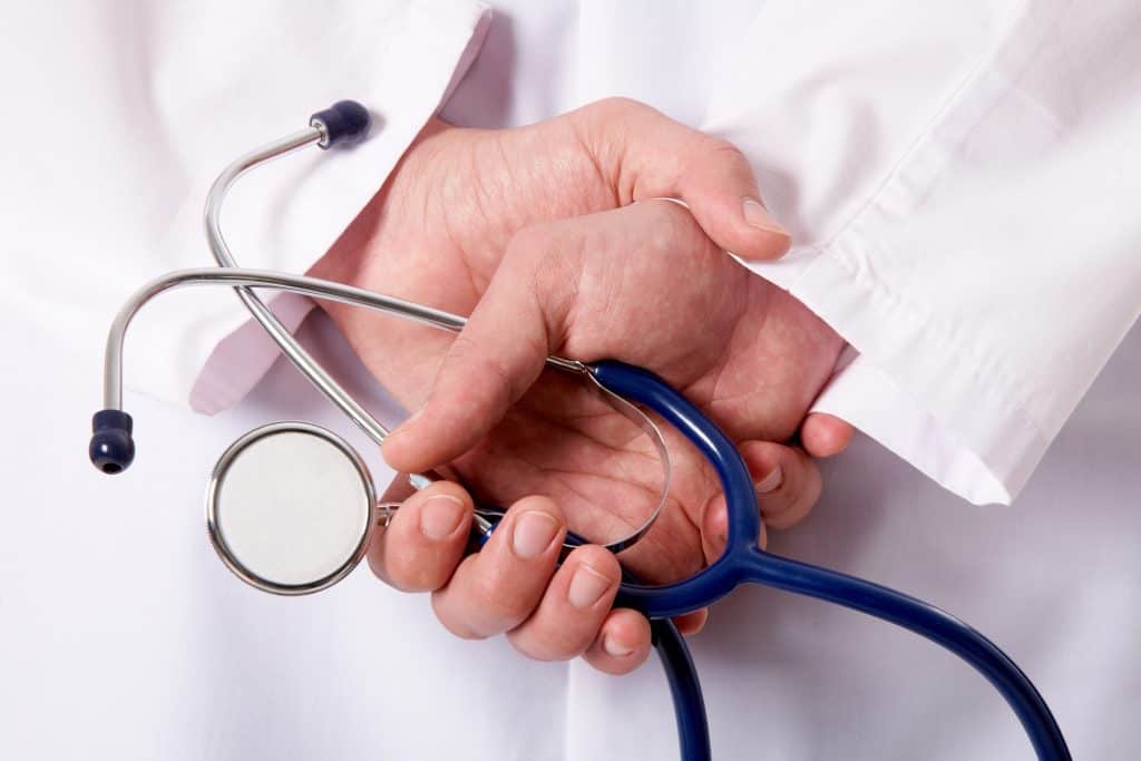 Doctor holding stethoscope