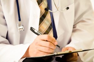 Doctor writing medical note