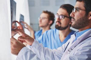 Doctors reviewing radiographic images