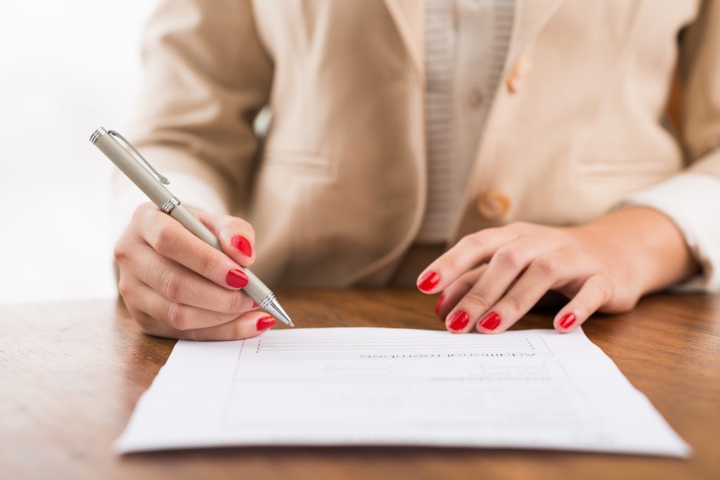 Person filling out a form