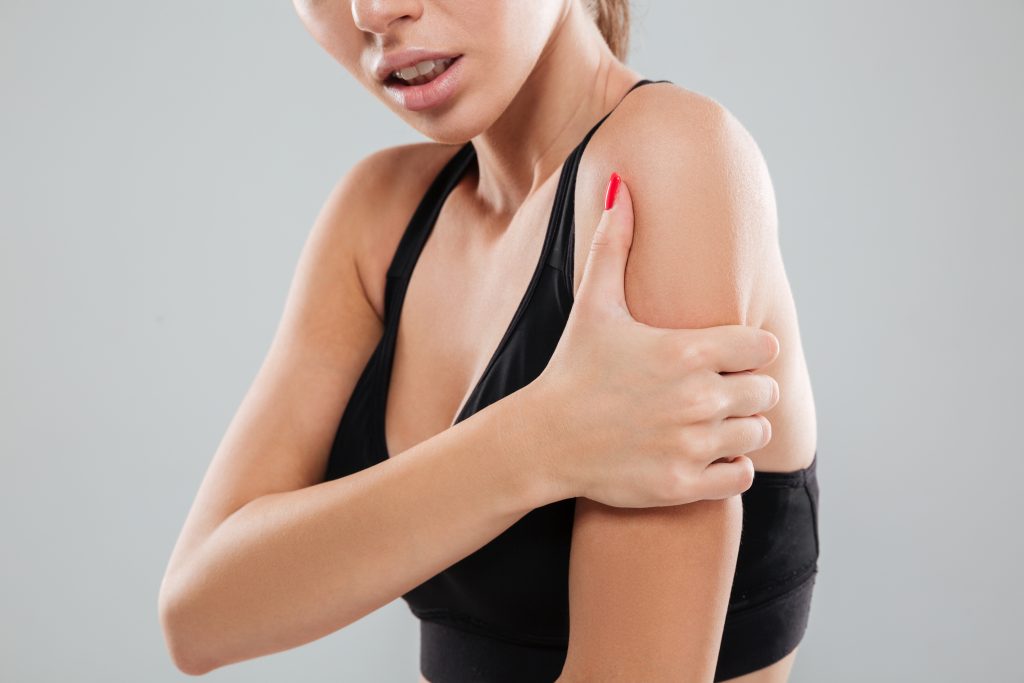 Person holding arm