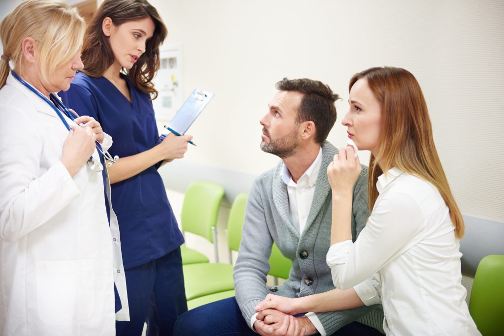 Doctors talking with patients