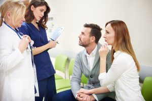 Doctors talking with patients