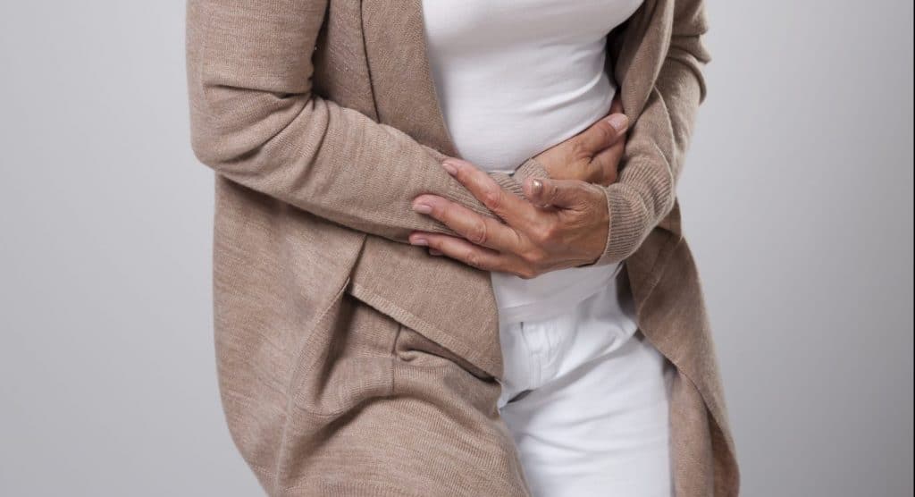 Person holding their stomach