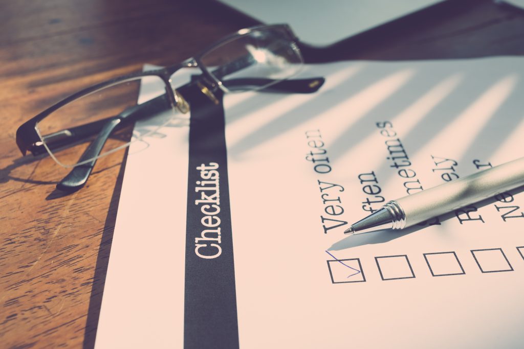 Checklist with a pen laying on it