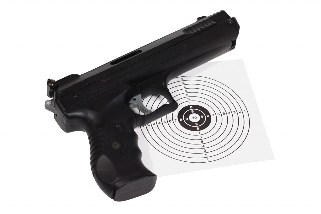 Firearm laying on a target
