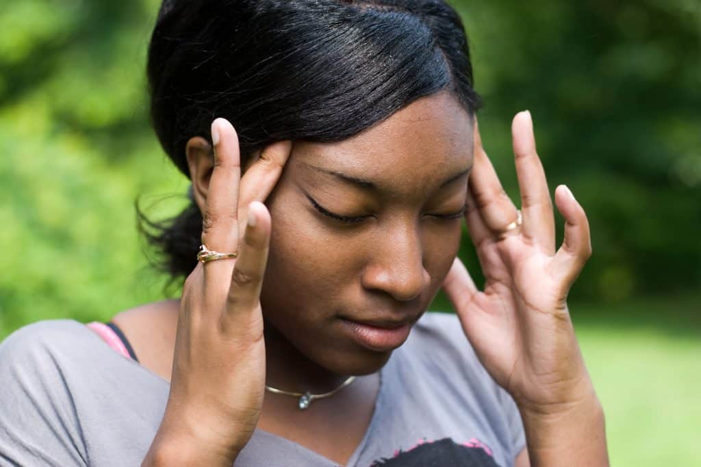 Person rubbing head