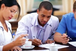 Doctors filling out forms