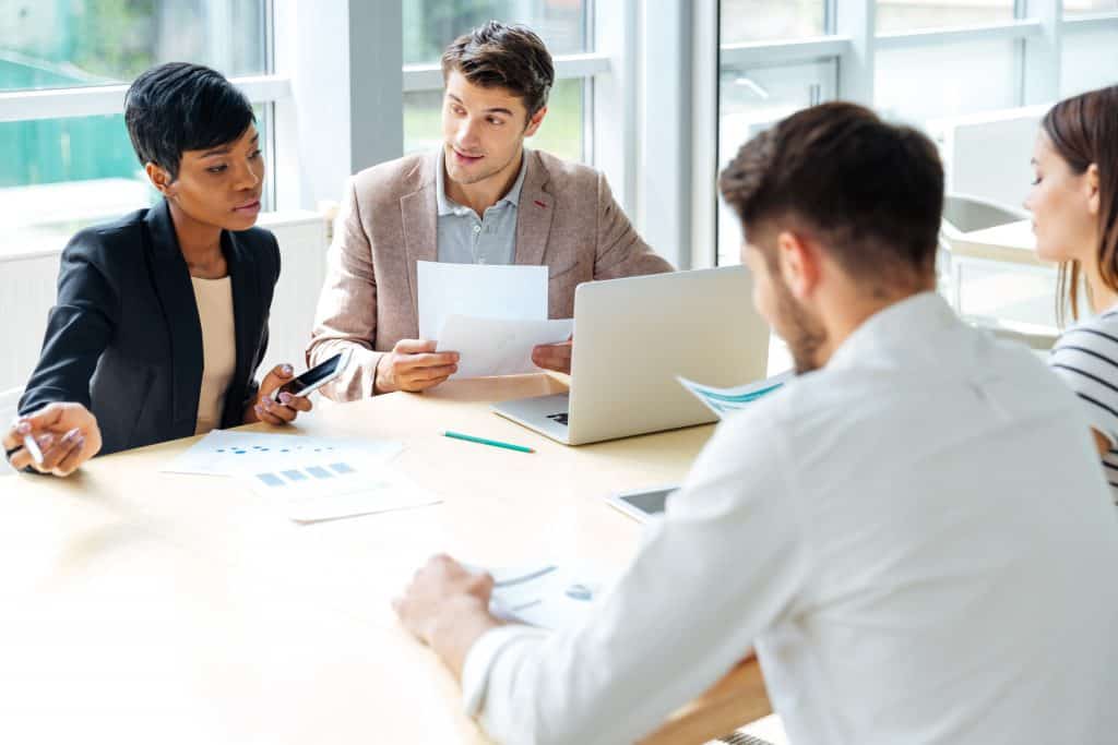 Business people sitting around a table
