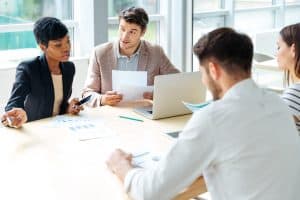 Business people sitting around a table