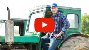 Person standing on a tractor