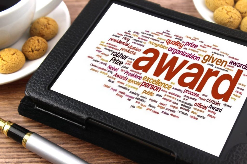 Tablet with the word "award" on the screen