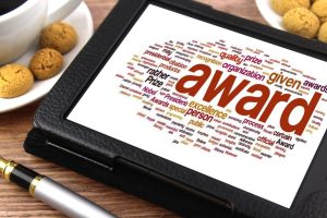 Tablet with the word "award" on the screen