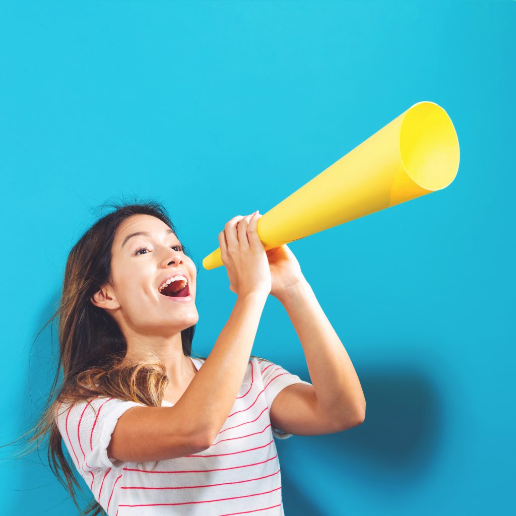 Person shouting into megaphone