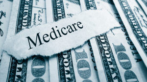 "Medicare" paper laying on top of money
