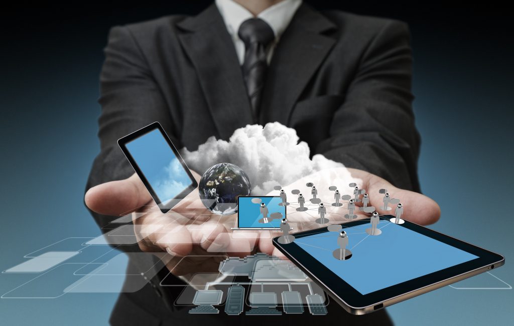 Preson holding tech devices in their hands