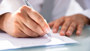 Person filling out a form