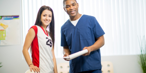 Physician reviewing document with patient