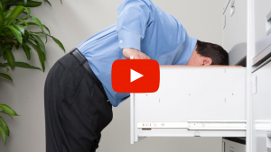 Person looking in a file cabinet