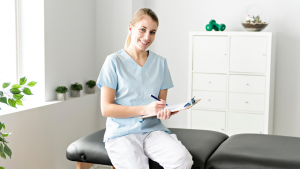 Chiropractic physician sitting on an adjustment table