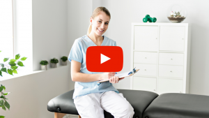 Chiropractic physician sitting on an adjustment table