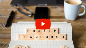 Health insurance spelled out with wooden tiles