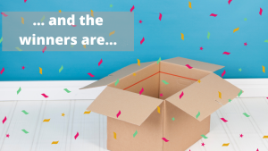 An open box with confetti flying