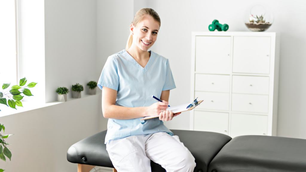 Chiropractic physician sitting on an adjustment table