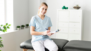Chiropractic physician sitting on an adjustment table