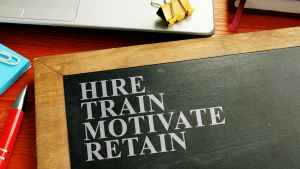 Hire, train, motivate, retain sign