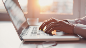 Hands typing on a keyboard