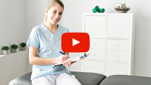 Chiropractic physician sitting on an adjustment table