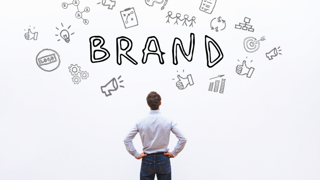 Person looking at "brand" written on a wall