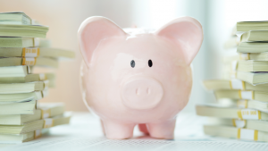 Piggy bank with stacks of money