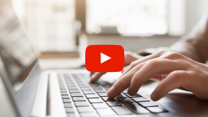 Typing on a laptop